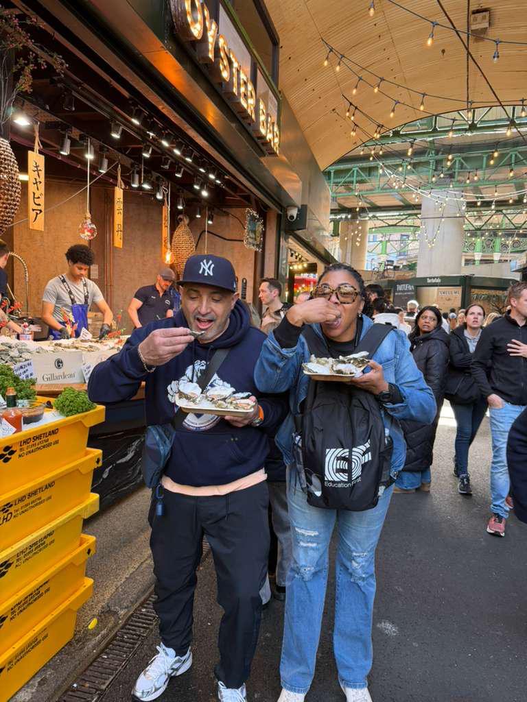 Two people eating oysters at Borough Market London