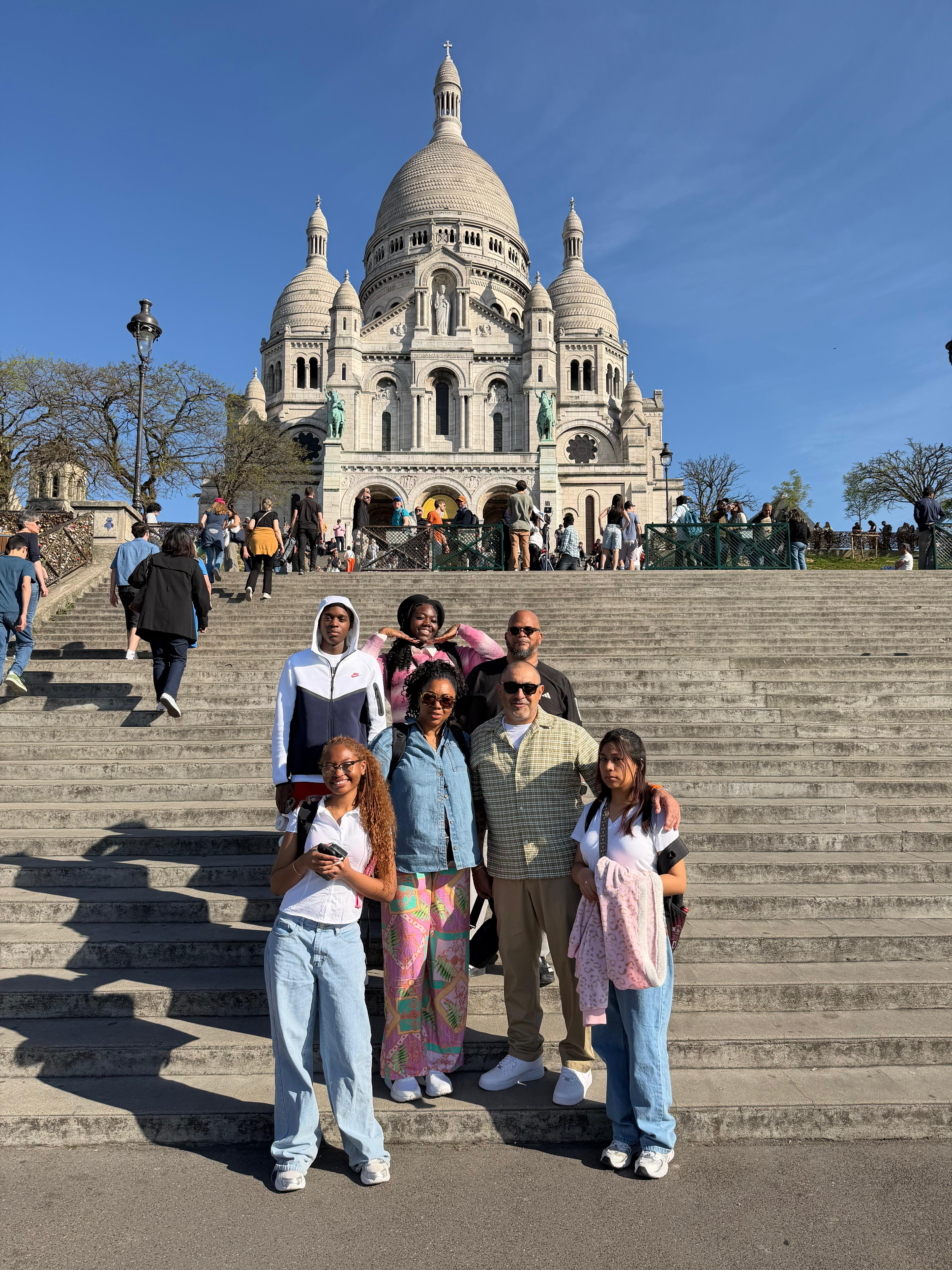 Students and chaperones posing on steps of Sacré-Cœur in Paris