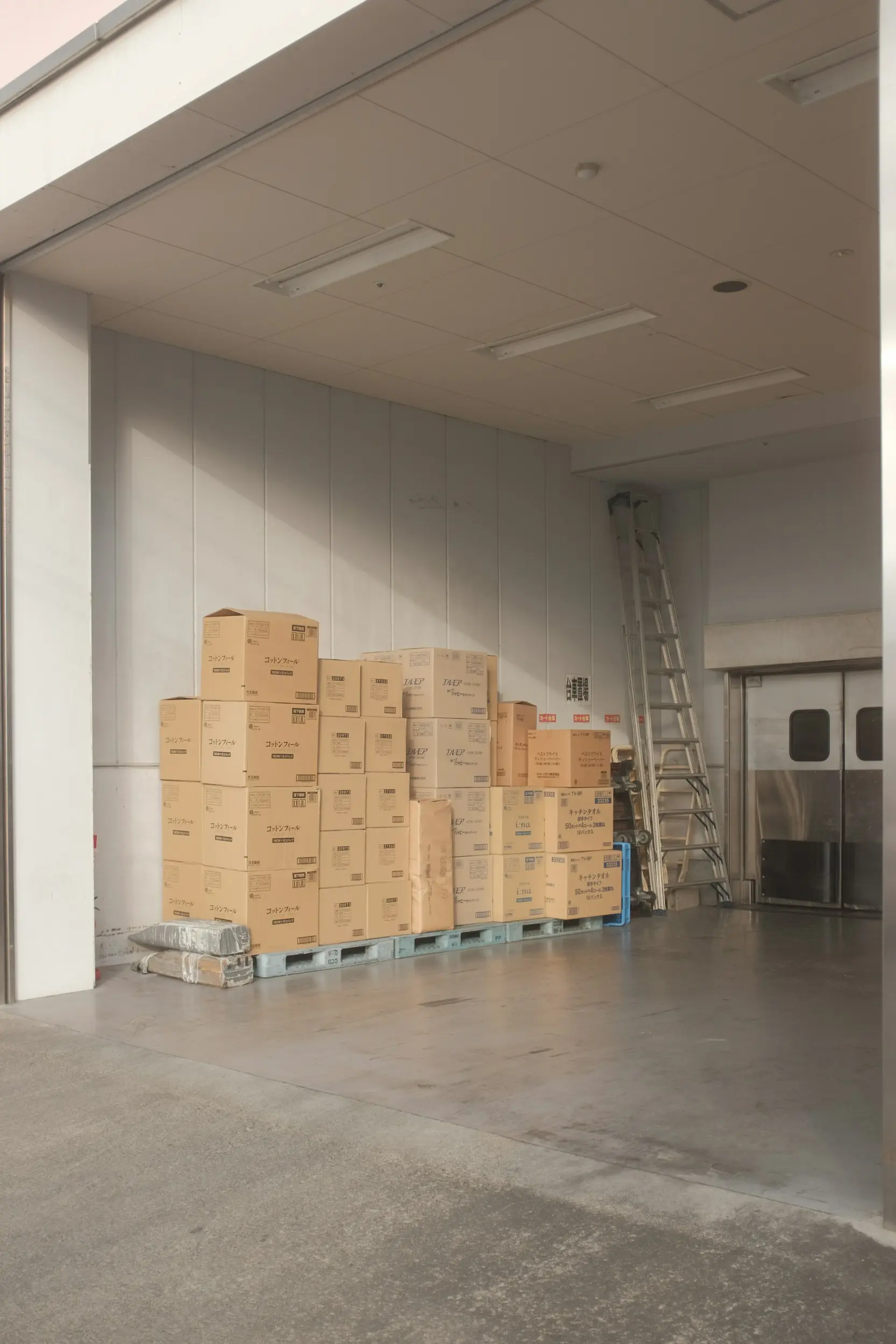 boxes stacked on pallets in warehouse