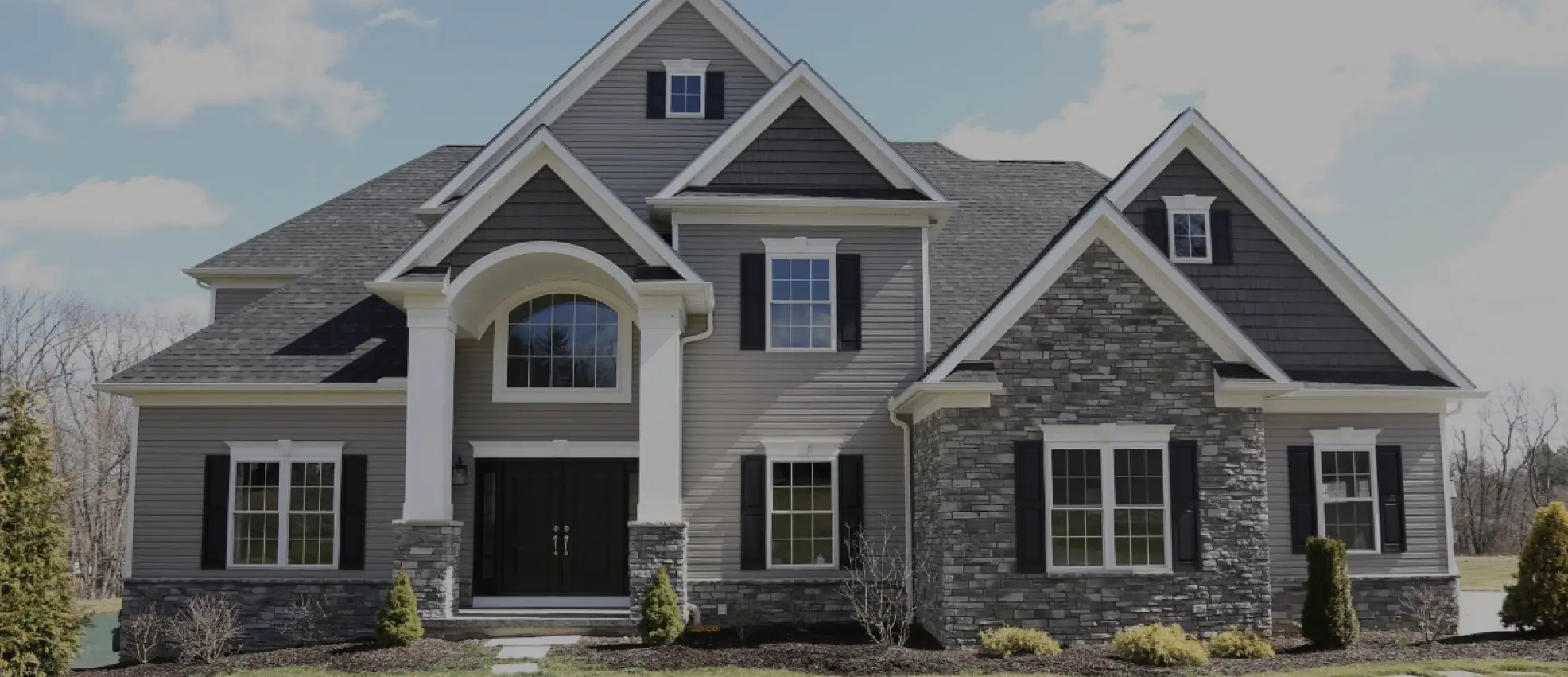 large home with accent stone siding