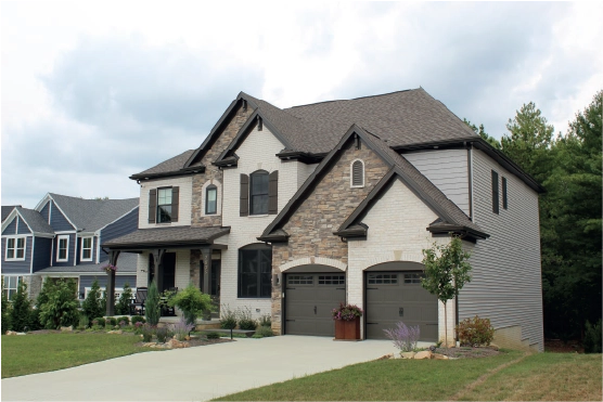 home with stone siding on garage siding