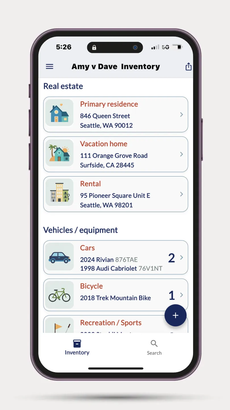The Divisly app showing a client's inventory grouped into real estate and vehicles
