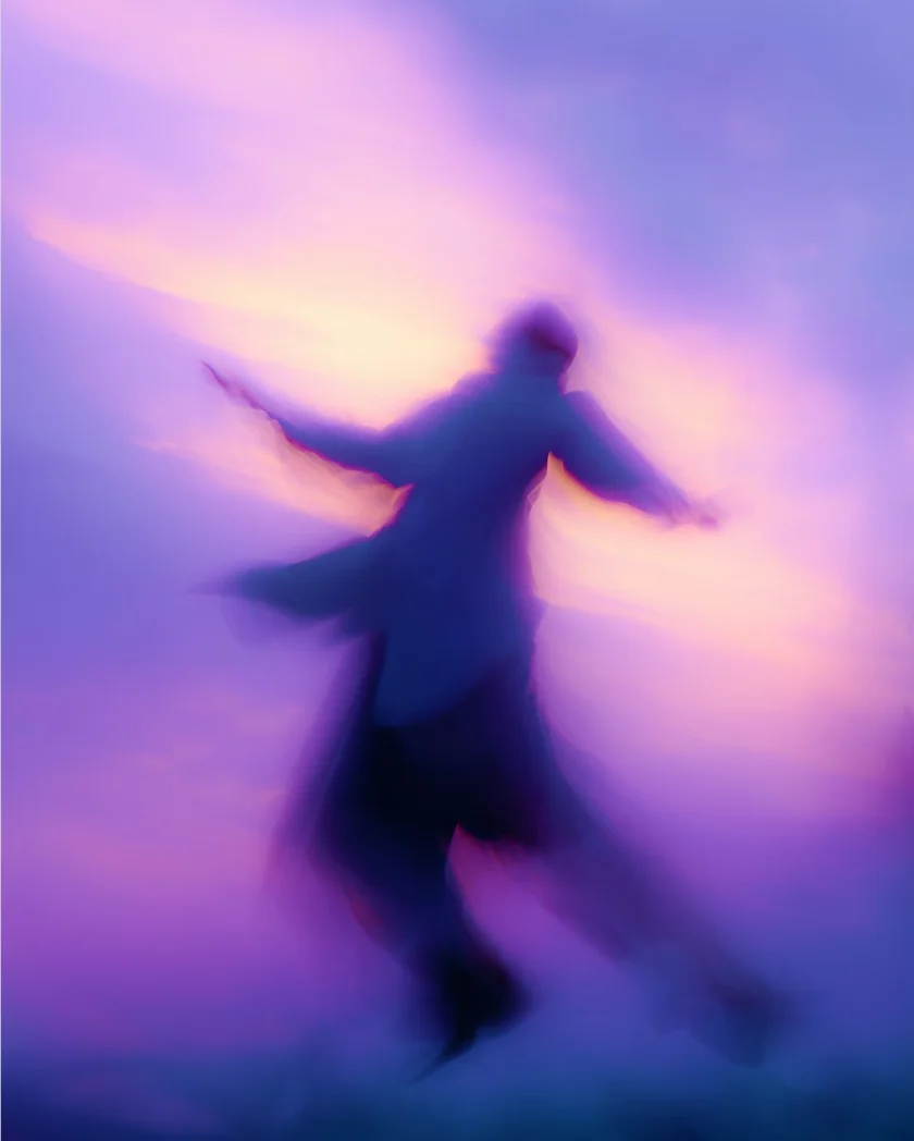 Blurred silhouette of a person with arms outstretched against a colorful purple and pink sky.
