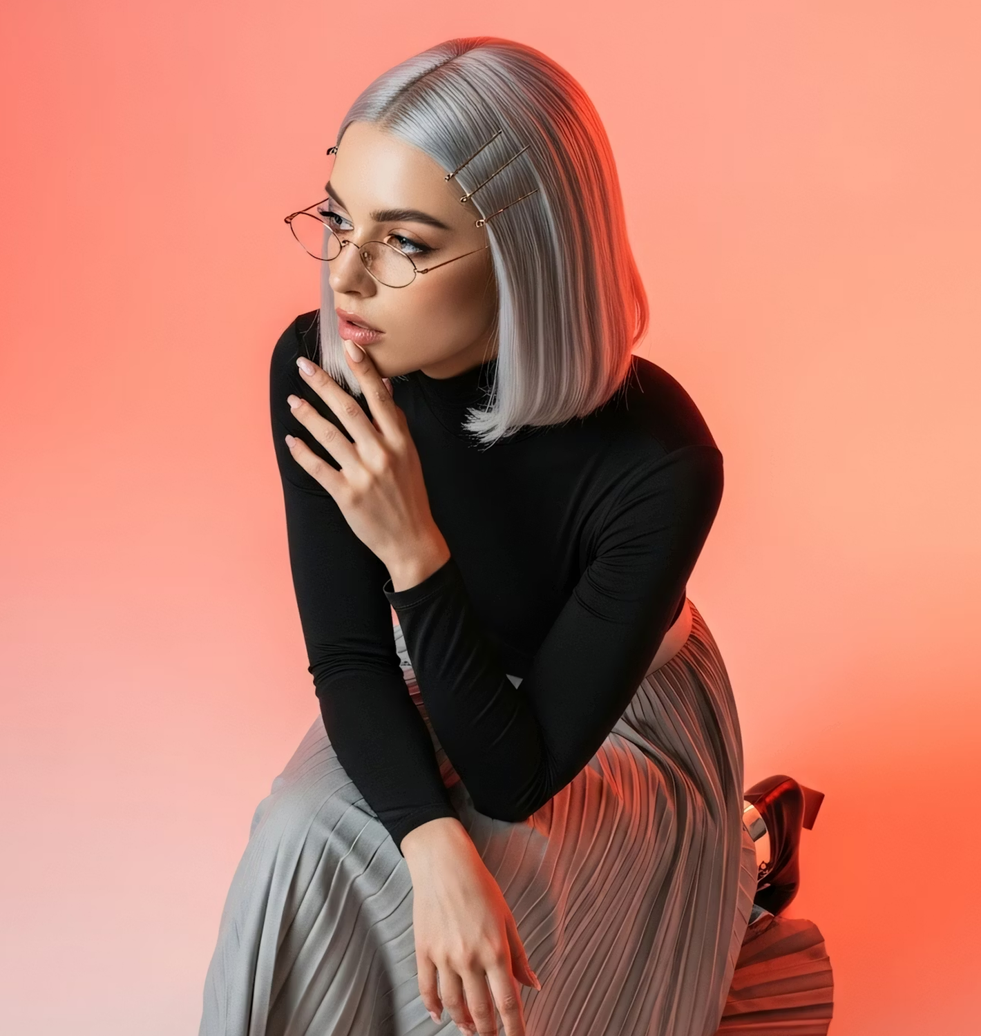 Blurred close-up of a person wearing protective goggles, a knit face covering, and a hood with a dark background.