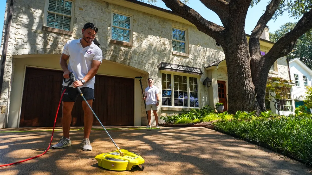 Residential driveway pressure washing with a surface cleaner in Dallas, TX