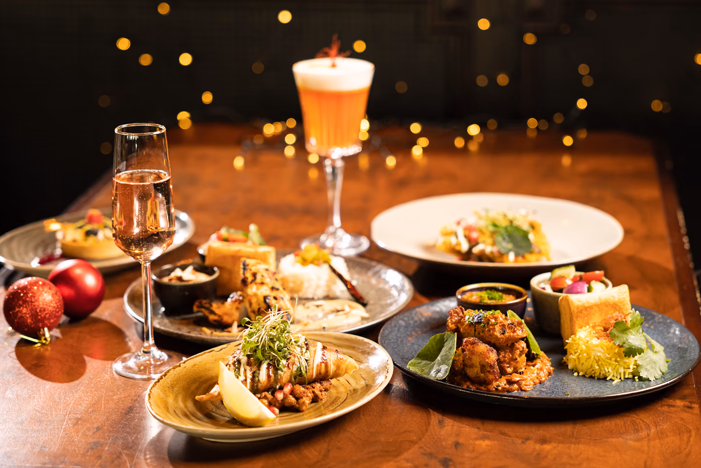 A table set with festive dishes and cocktails at Doolally