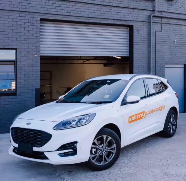 White car with a Sell My Salvage logo