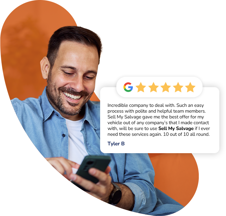 A smiling man in a blue shirt looks down at his phone while sitting against an abstract orange background. Next to him is a review card with a Google 5-star rating and a testimonial praising “Sell My Salvage” for an easy process, helpful team, and offering the best price, signed by Tyler B.