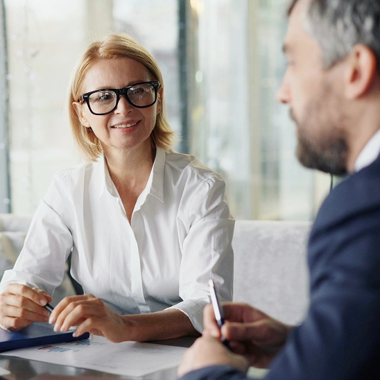 Business woman in eyeglasses and a white shirt
