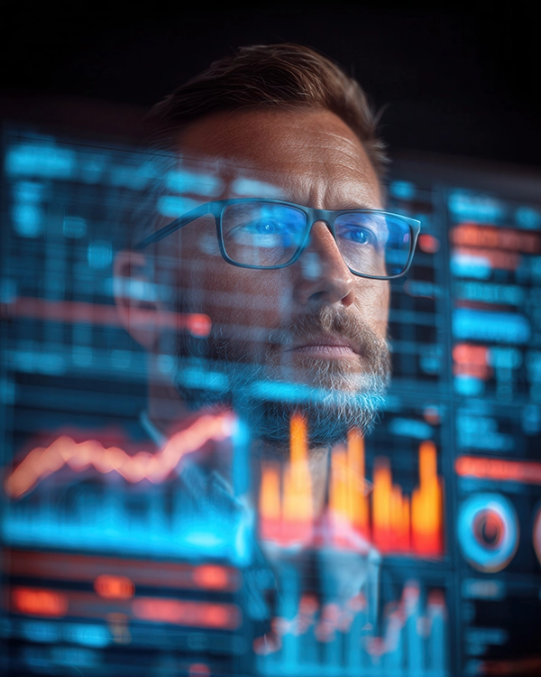 Man reviewing financials on a screen.
