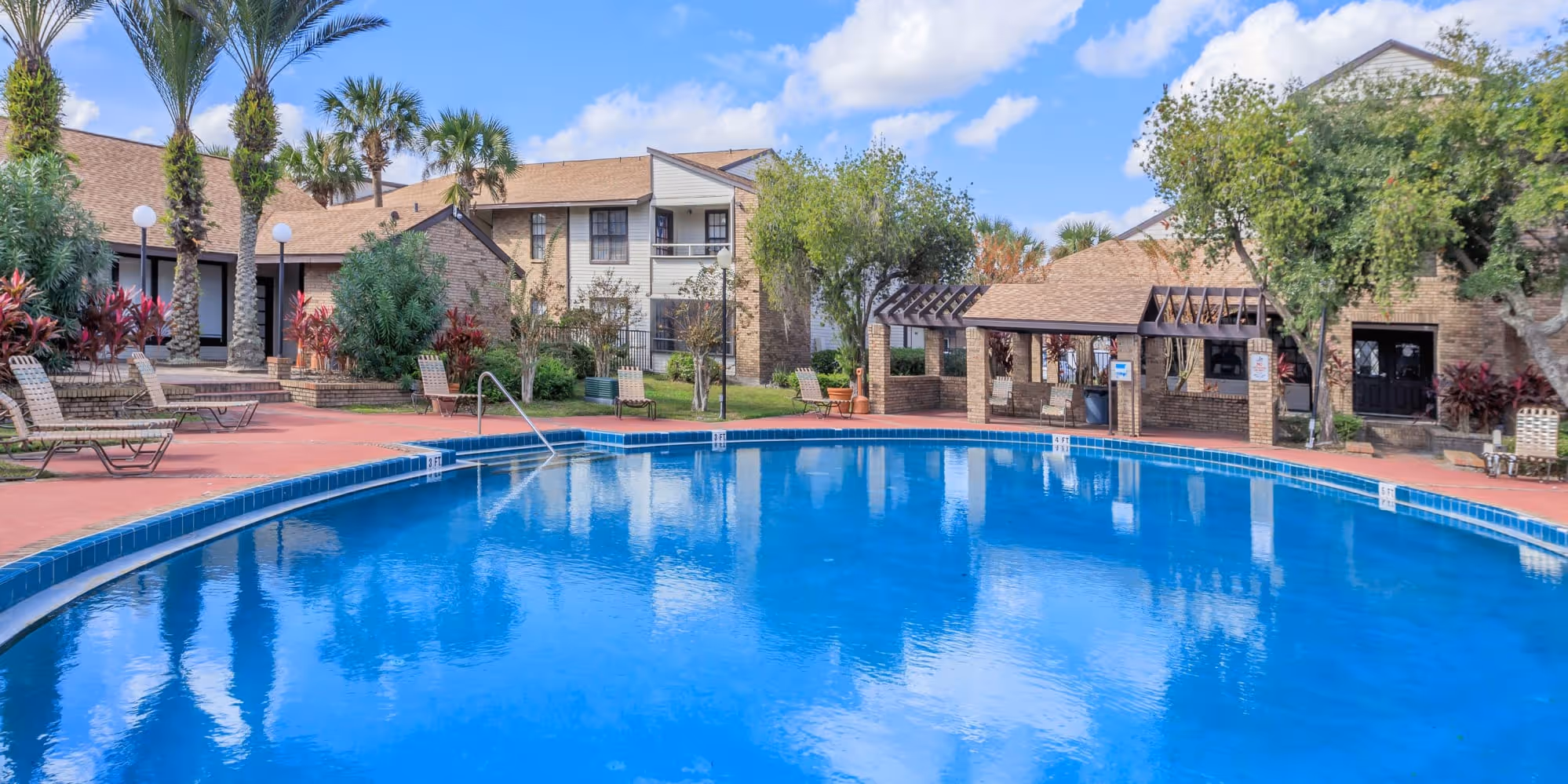 Swimming Pool with view of cabana and lounge chairs
