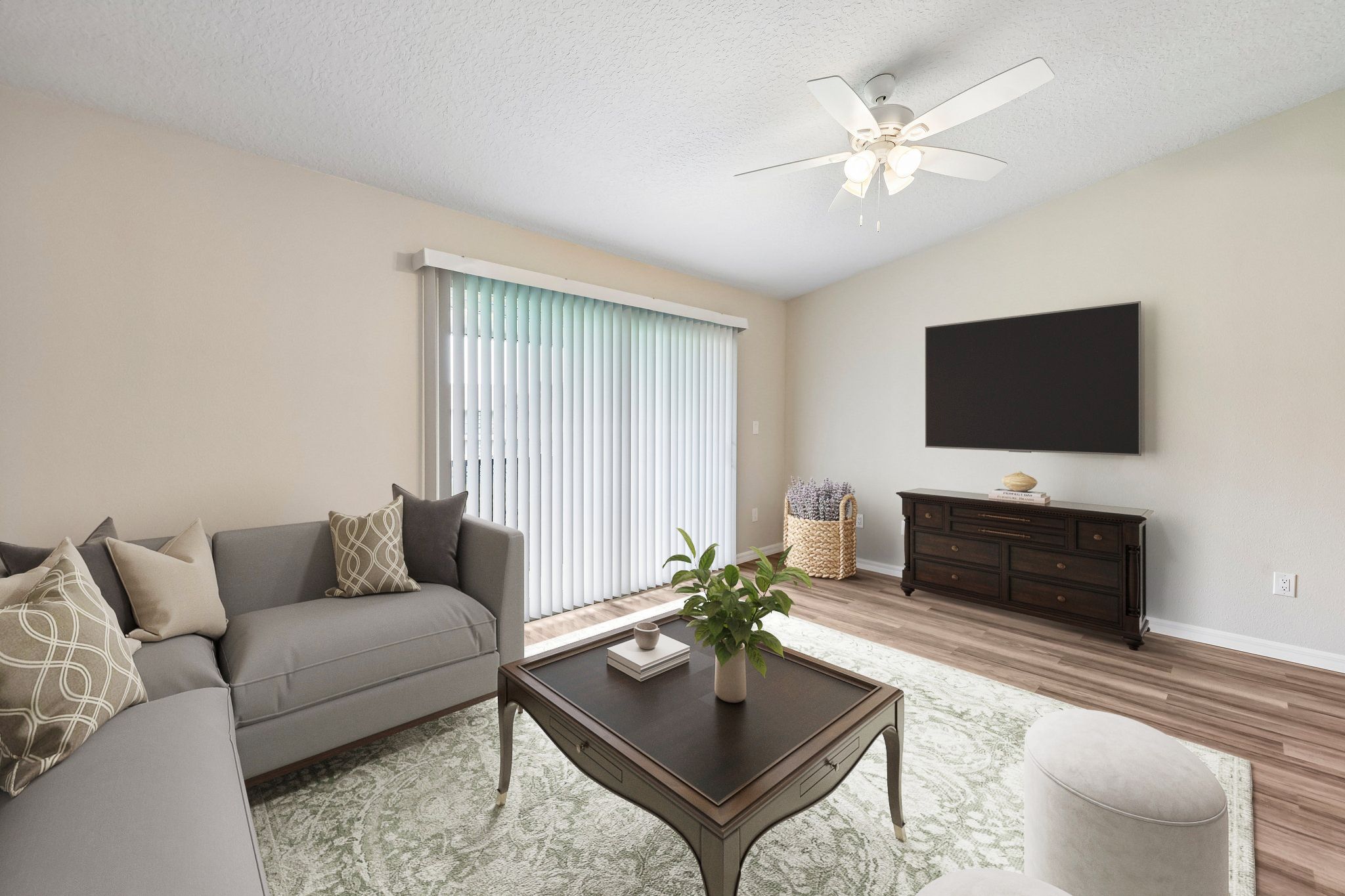 Living area with virtually stages sofa, coffee table, and chairs