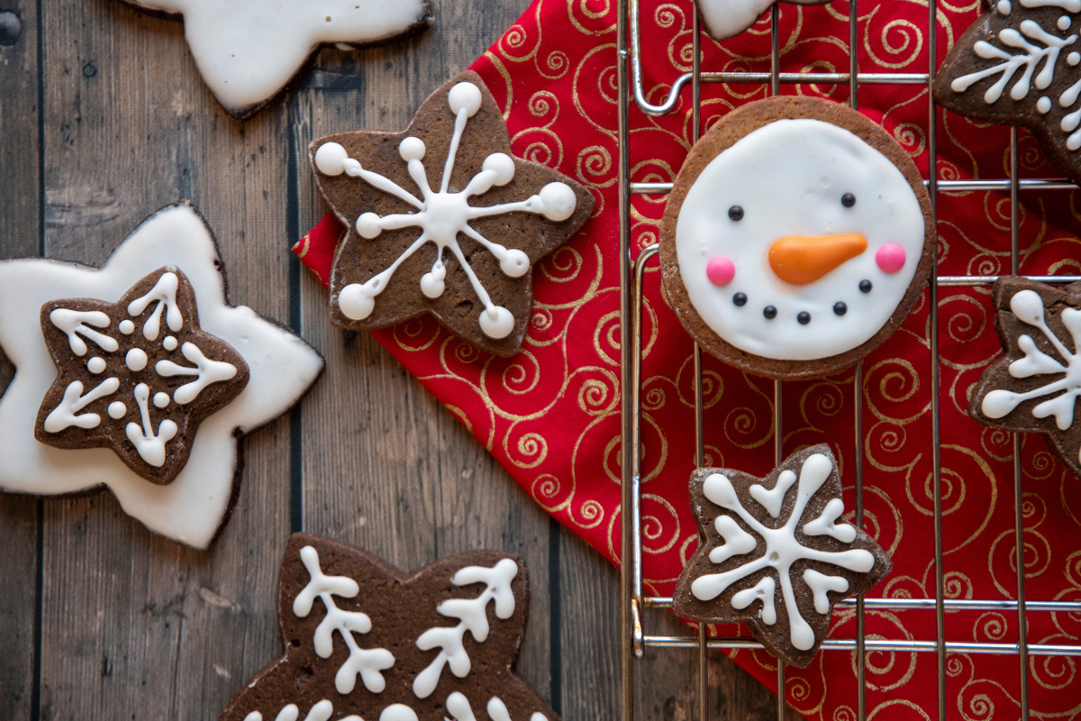 Spread of Christmas cookies on a table and red cloth