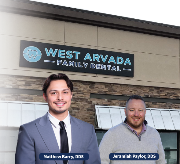 Dr. Barry and Dr. Paylor smiling in front of dental practice