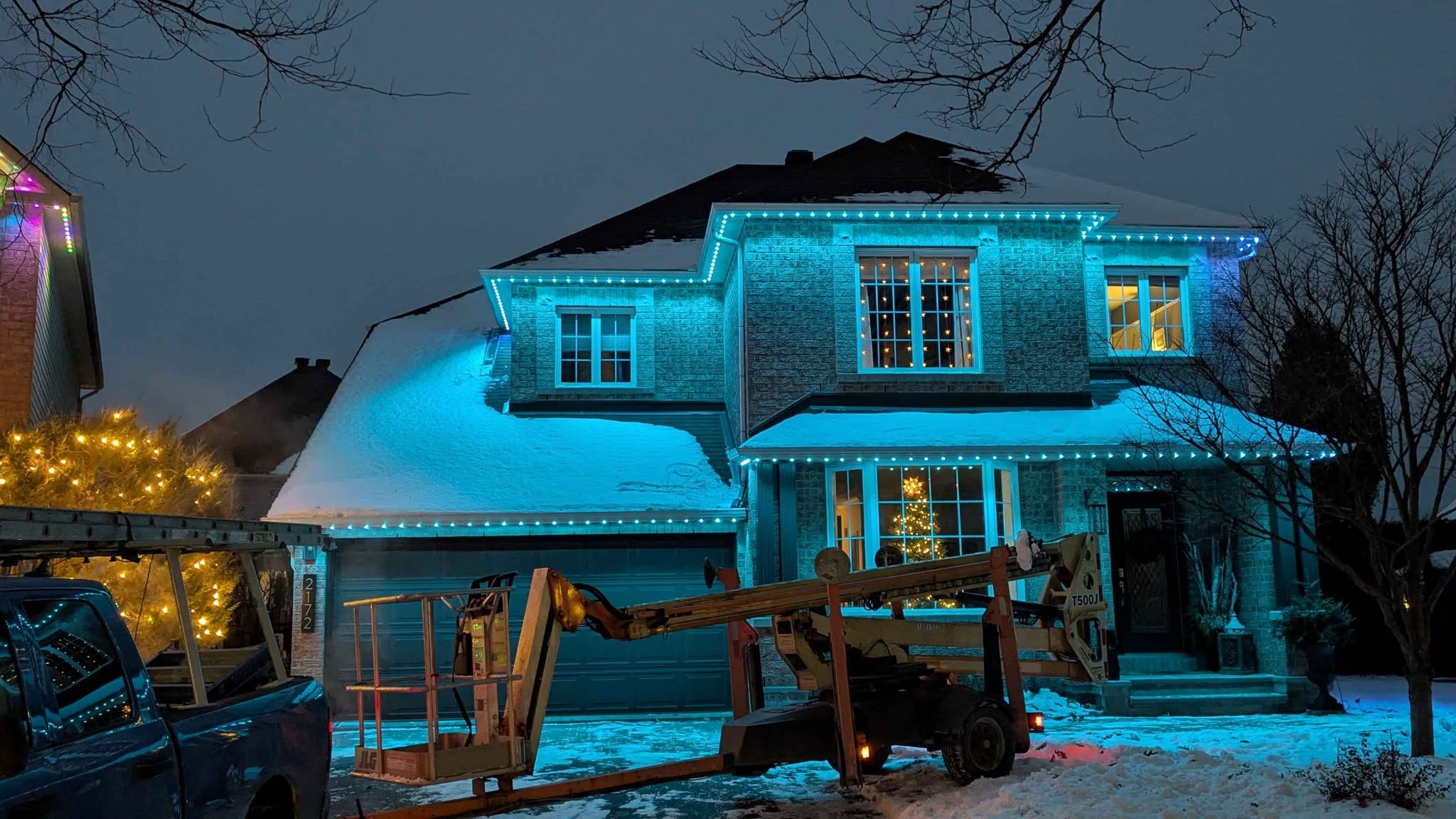Cyan permanent lighting on a home in winter