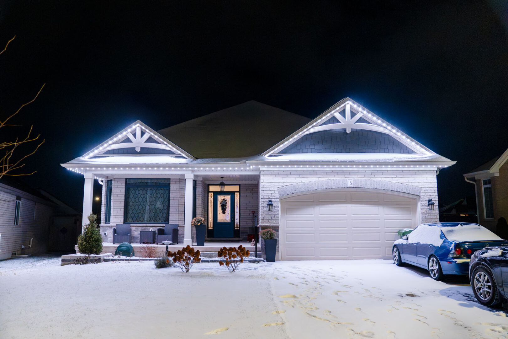 White permanent lighting on a bungalow in winter
