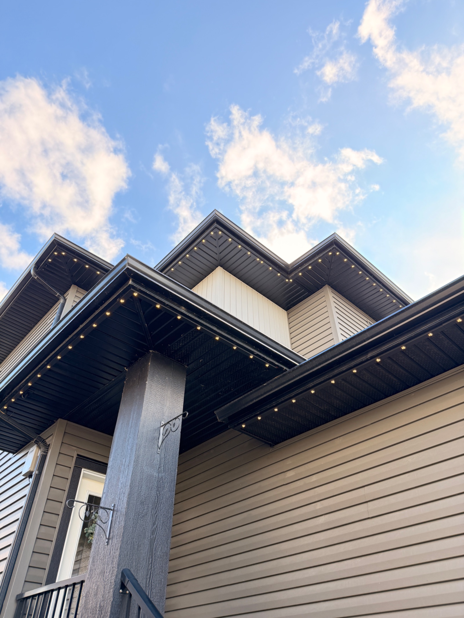 Permanent LED track following multiple soffit and roofline sections in daylight