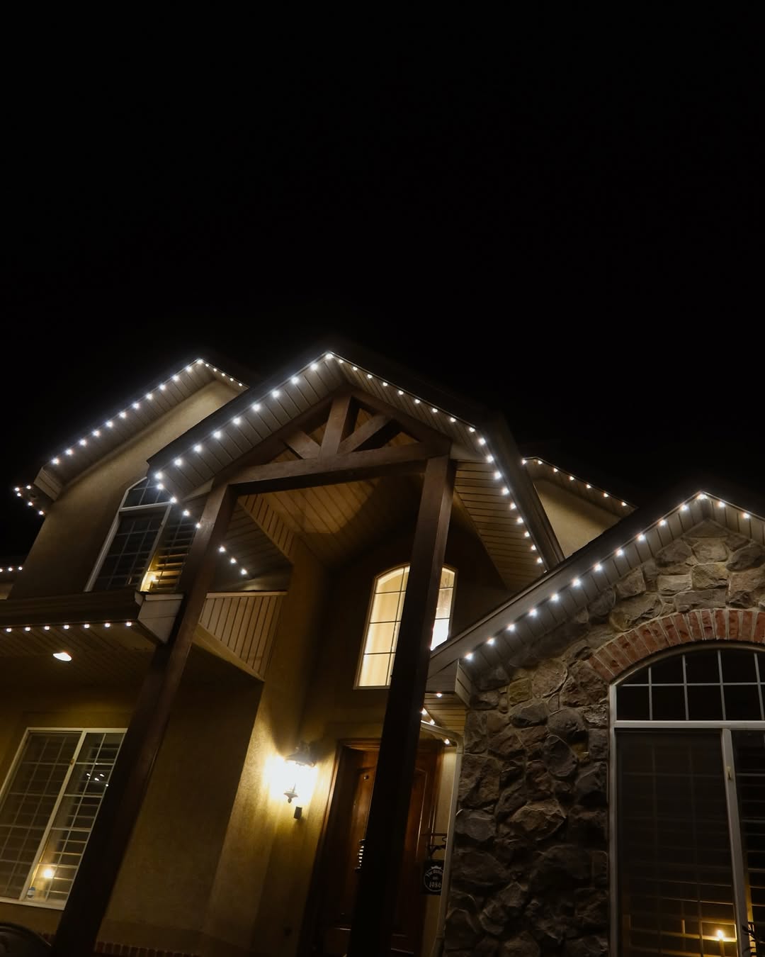 Permanent lighting under a timber-framed entry