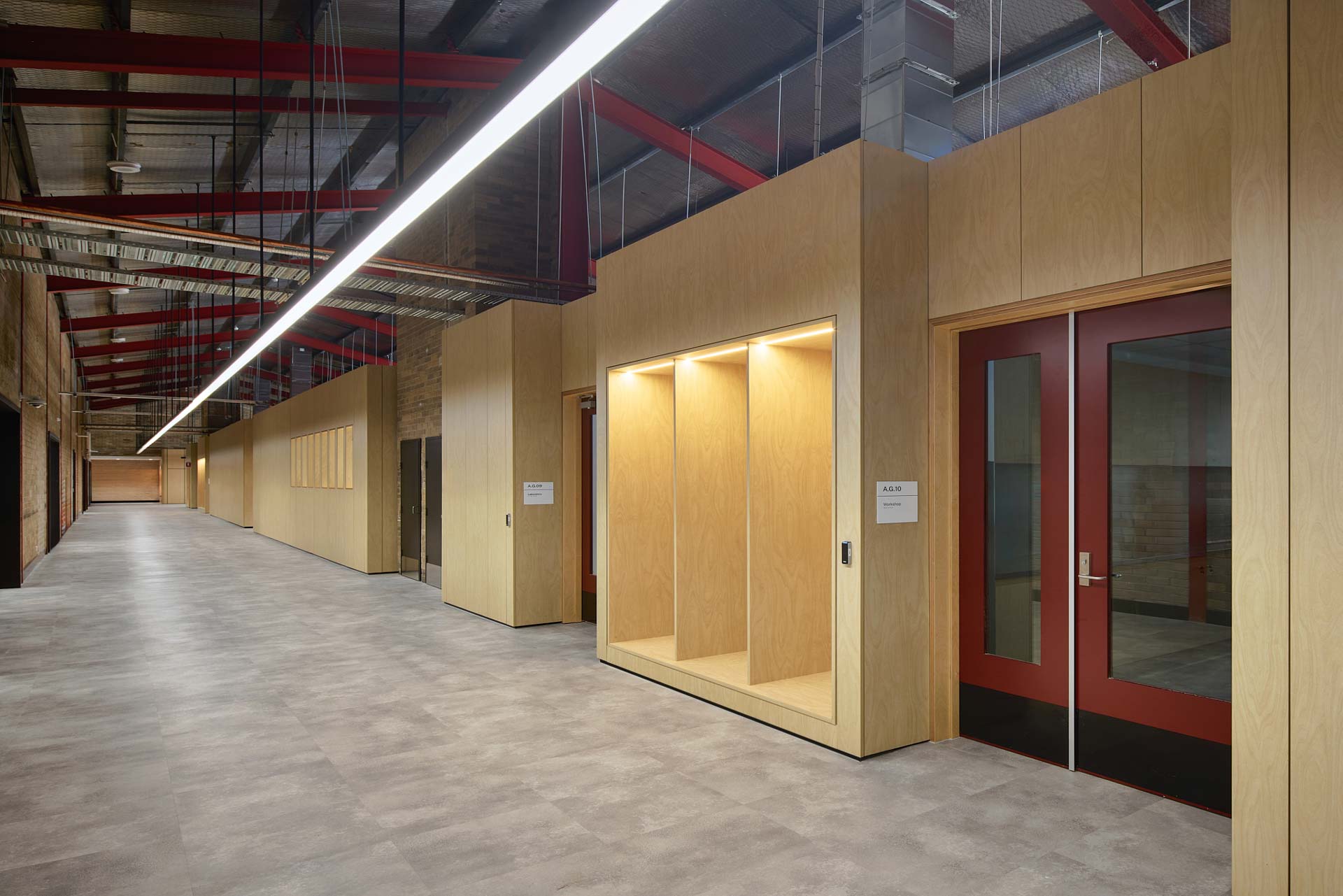 Hallway in the Tafe Padstow building, showinf the many rooms made out of XFrame with Tasmanian Oak exterior linings.
