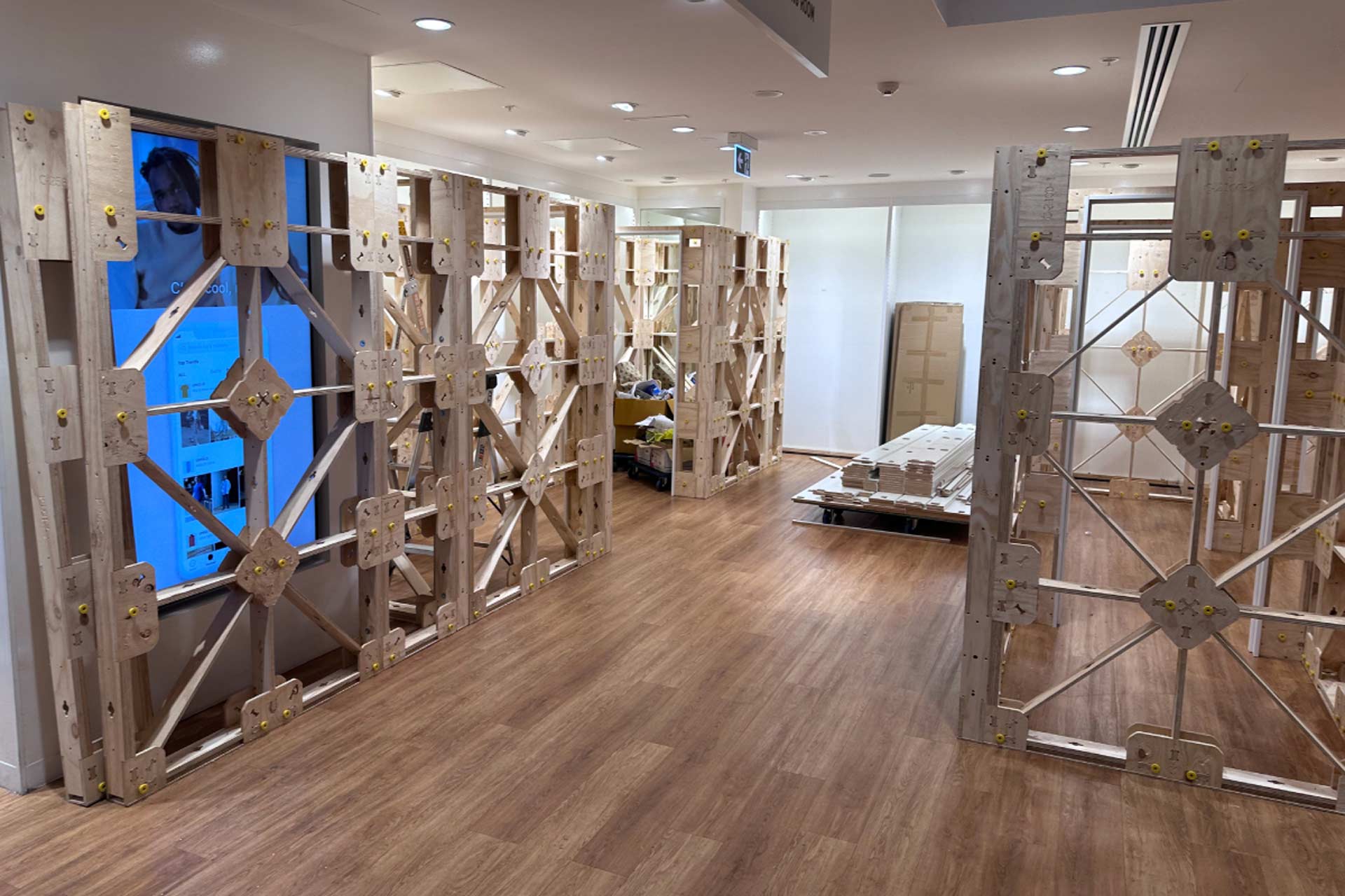 Bare XFrame panels for the changing rooms, in their respective spaces.