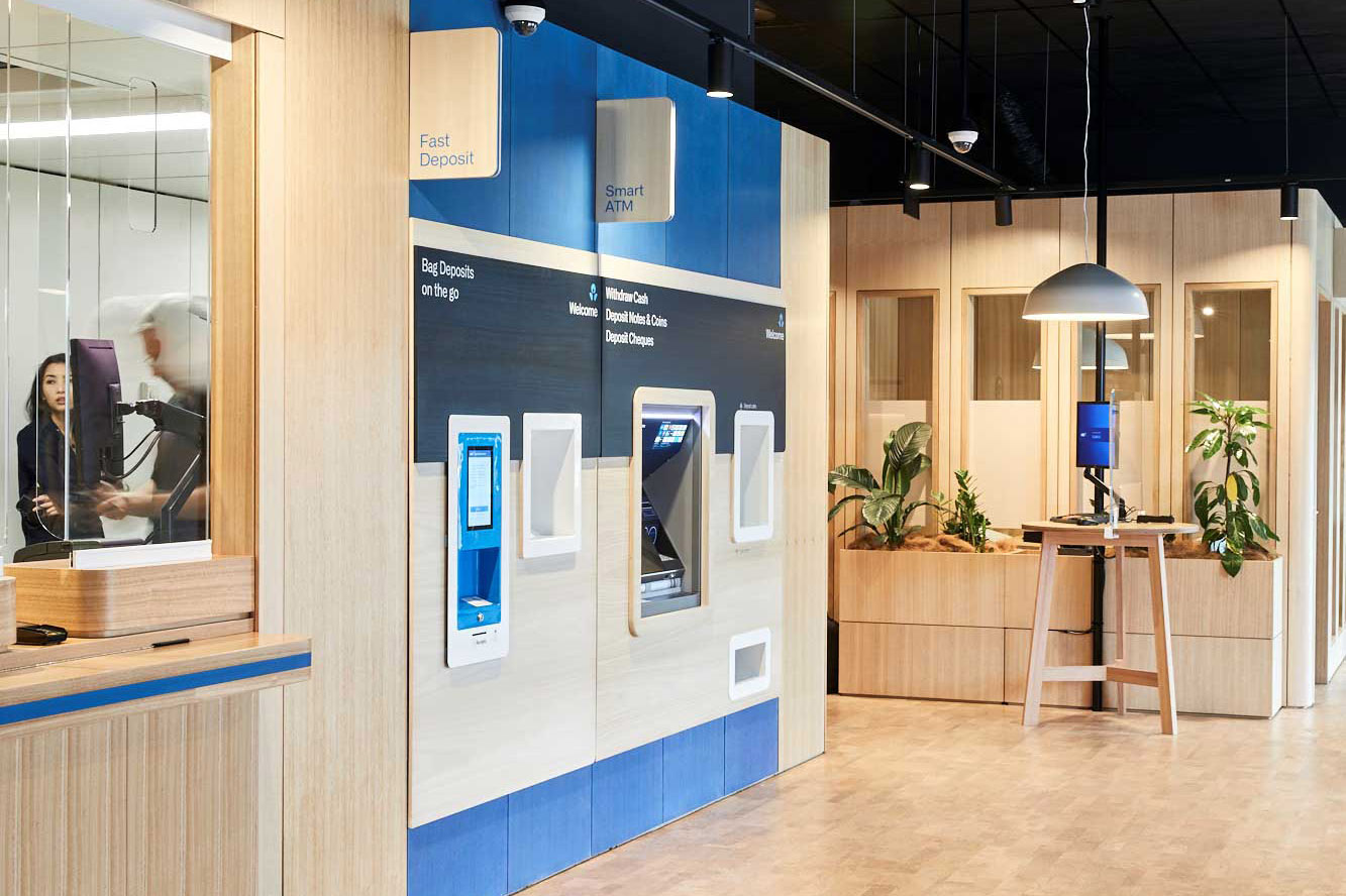 Close up of a Fast Deposit ATm and a Smart ATM inside ANZ Springvale store. with some meeting rooms made out of XFrame in the background, with XFrame planters.