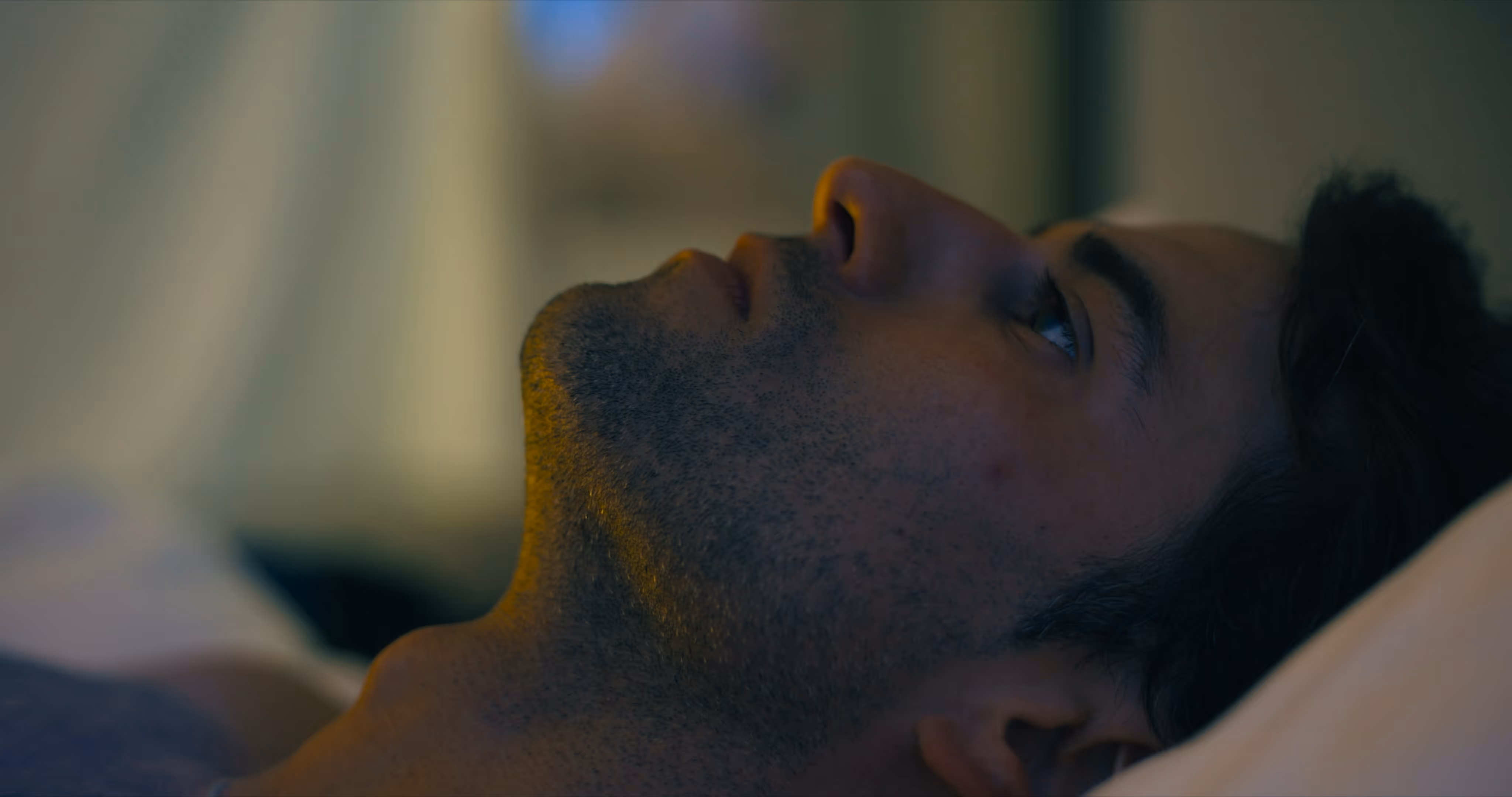 Felipe Nasr lying down looking upwards with a thoughtful expression in low light - 2DIE4 Film