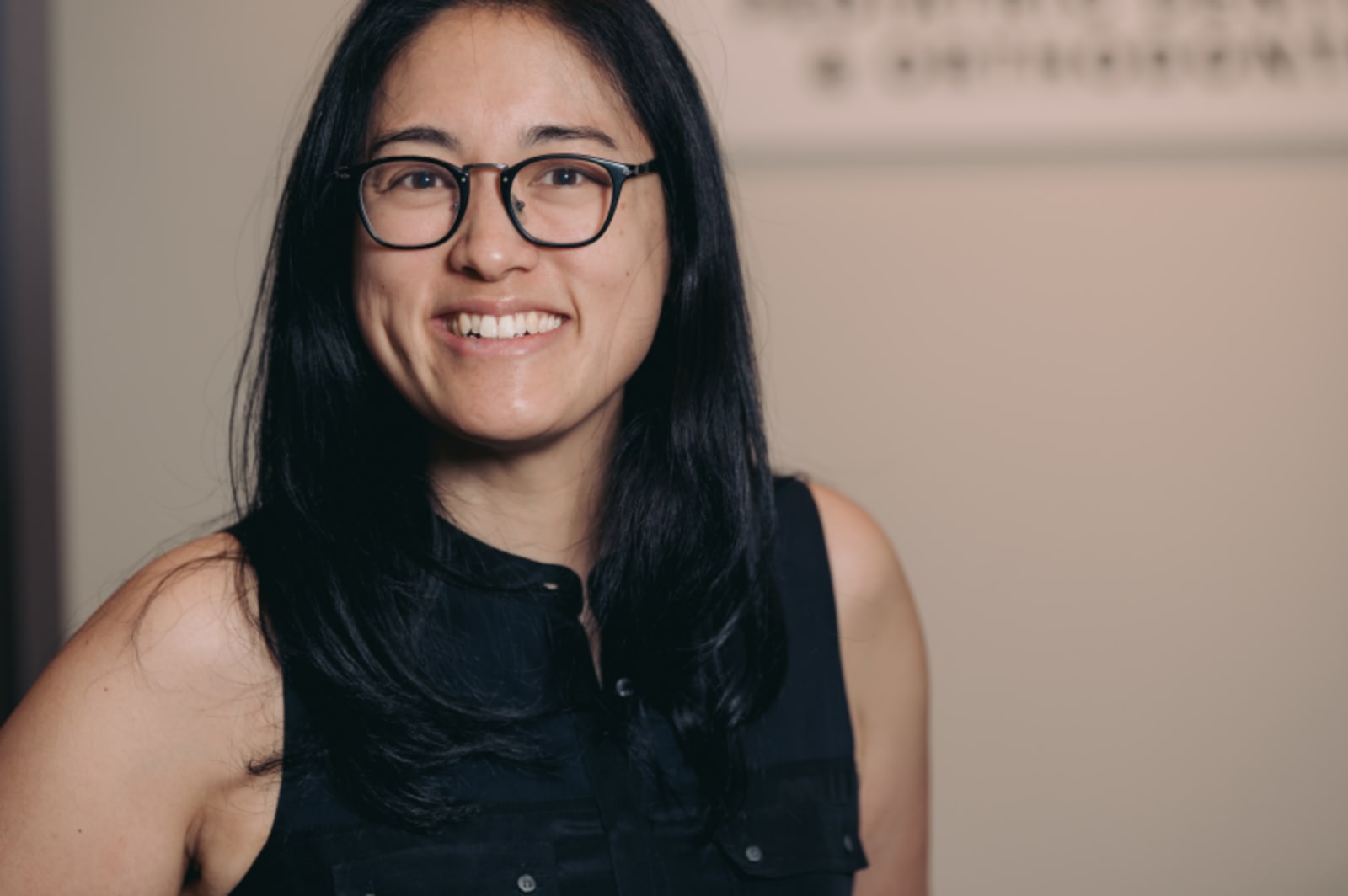 Woman team member in Nova Pediatric Dentistry office smiling at camera