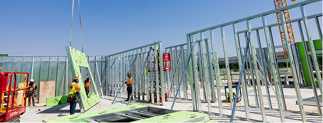 Steel framing installation on active construction site