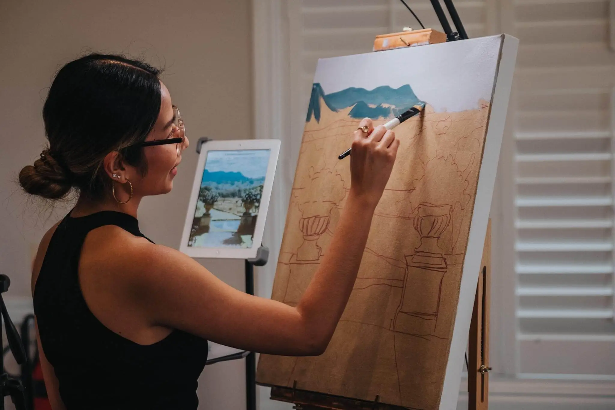 Live painting in Hunter Valley a landscape on a canvas with mountains and vases