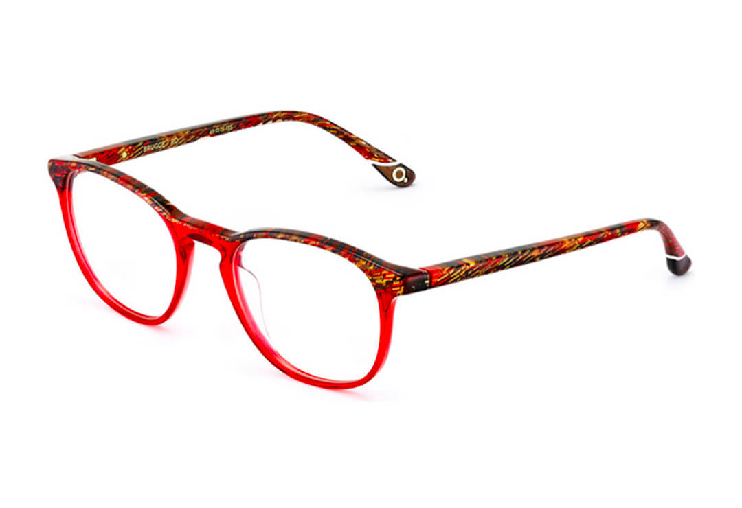 Red tortoiseshell round glasses frames on white background.