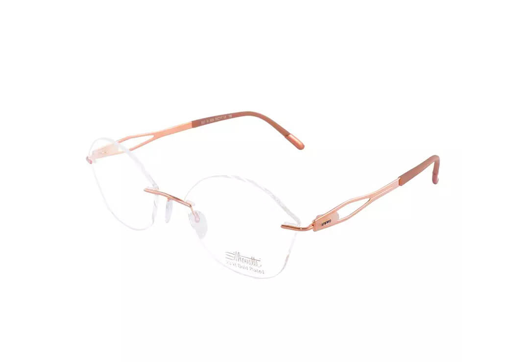 Delicate rimless rose-toned glasses frames on light background.