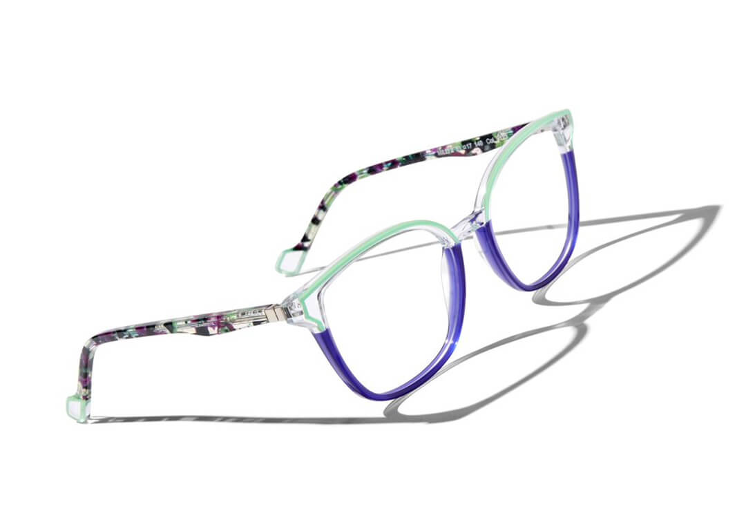 Angular cat-eye glasses frames with purple and black detailing.