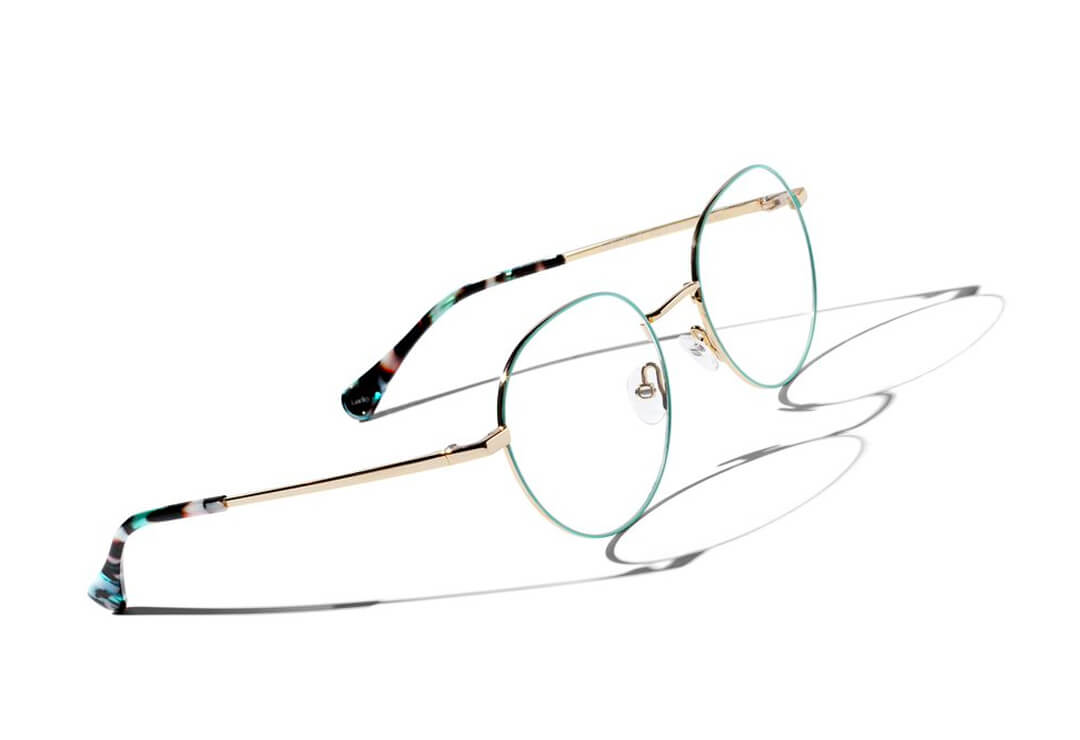 Slim minimalist glasses frames with subtle coloured end tips.