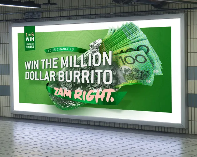 A large billboard in a subway station with a lot of money.