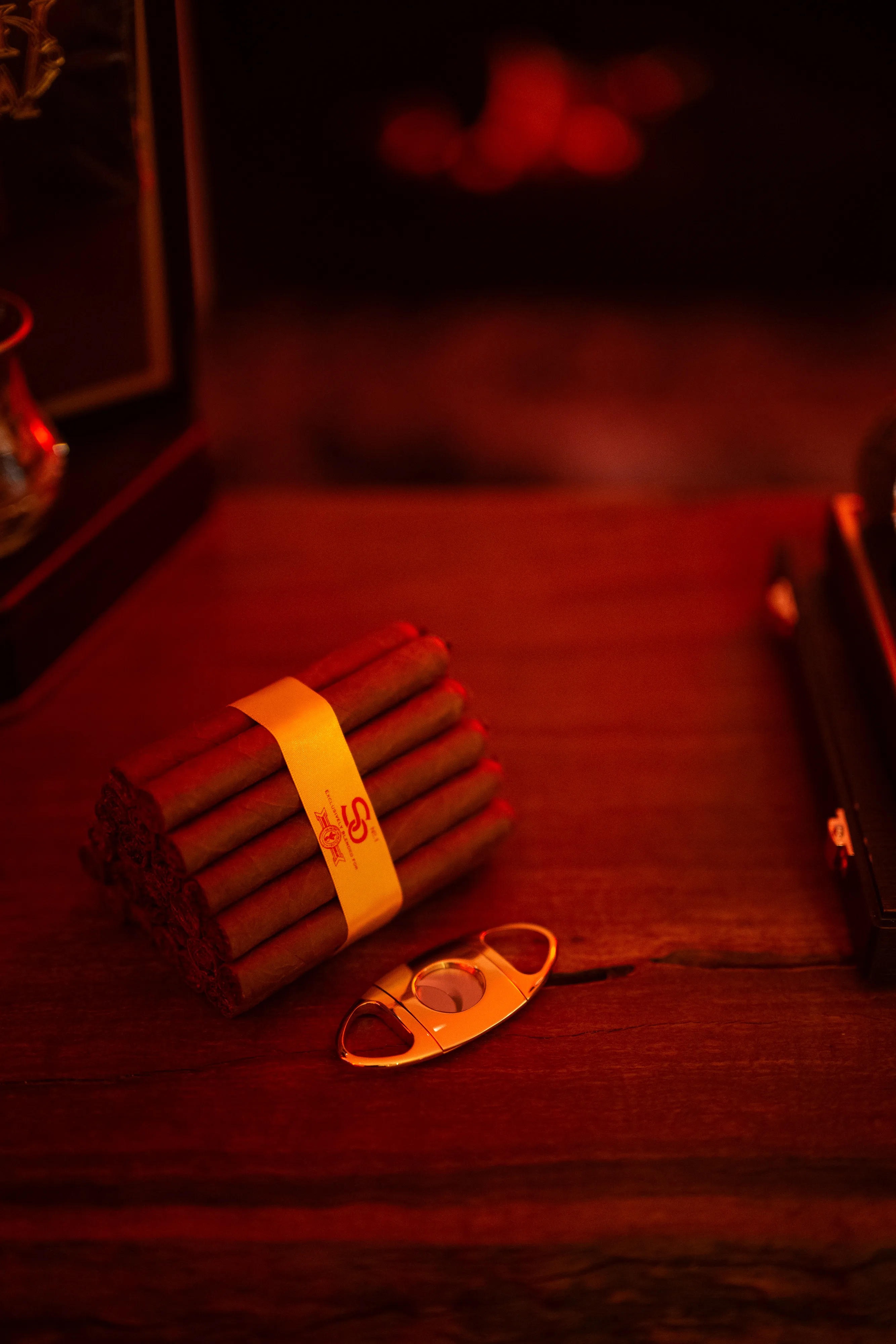 A pair of scissors sitting on top of a wooden table.