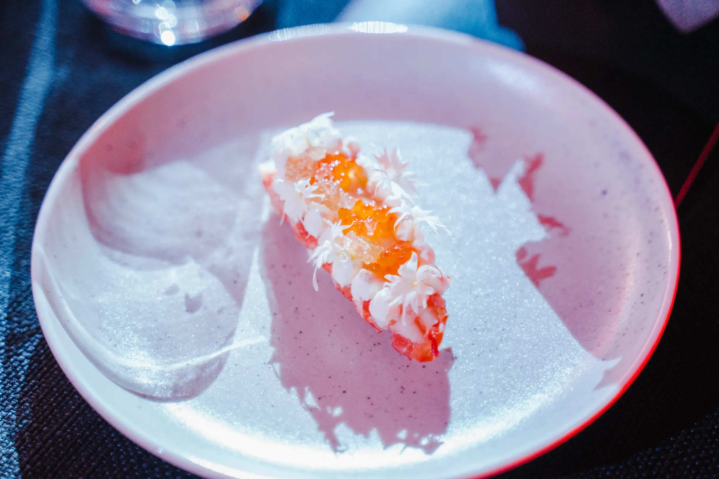 A piece of cake on a plate on a table.