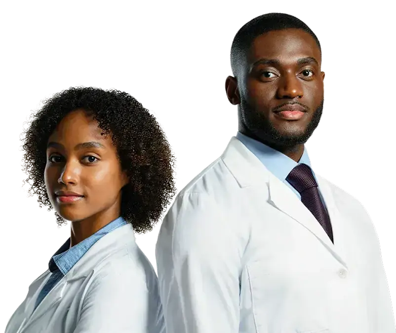 Confident male and female doctors standing back to back wearing white lab coats.