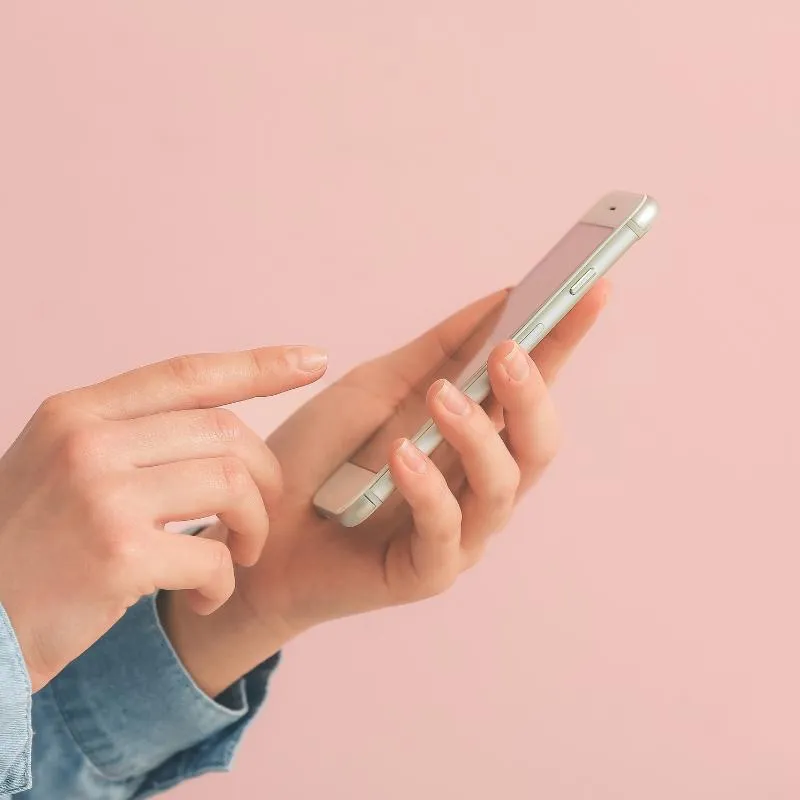 Person using a phone for a helpline