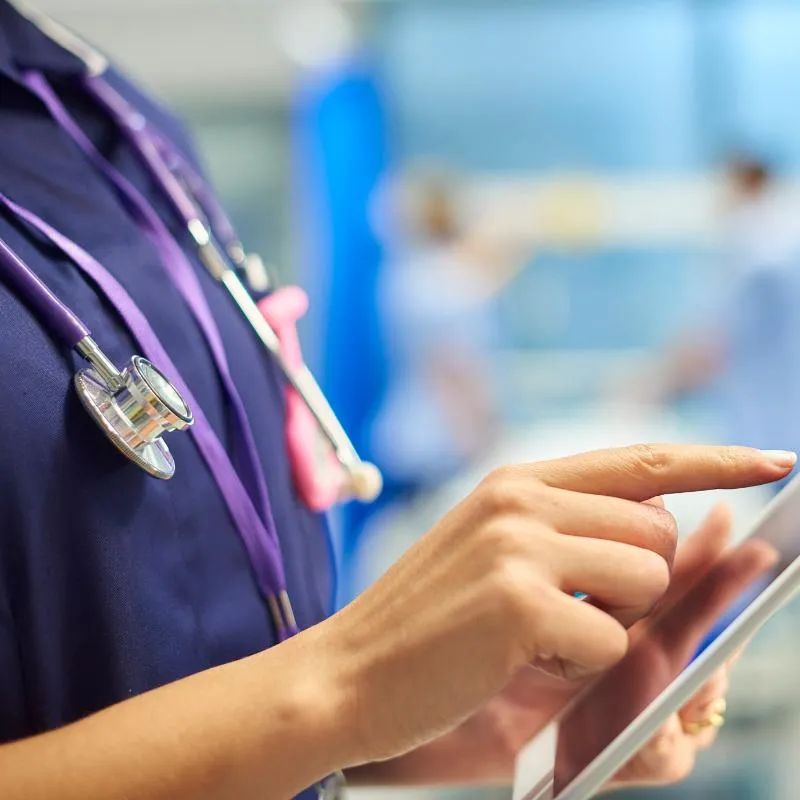 Health professional using a tablet