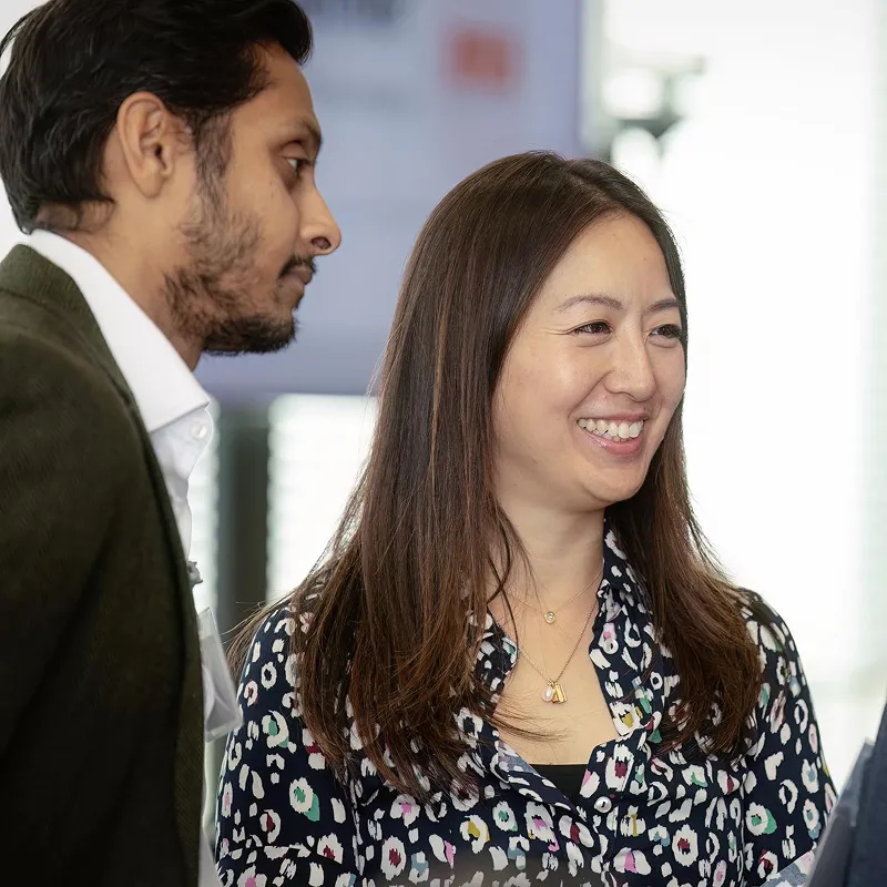 Two people talking at an MS Together event