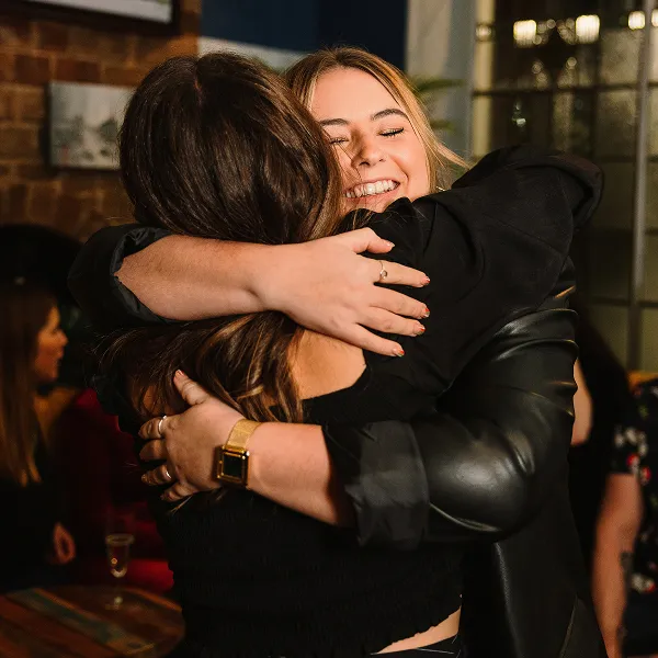 People hugging at an MS Together event