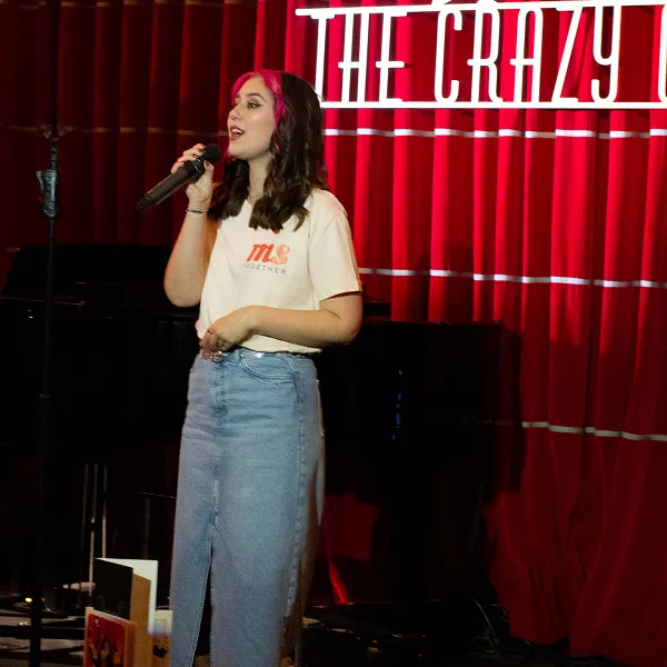 Person singing in a musical to fundraise for MS Together