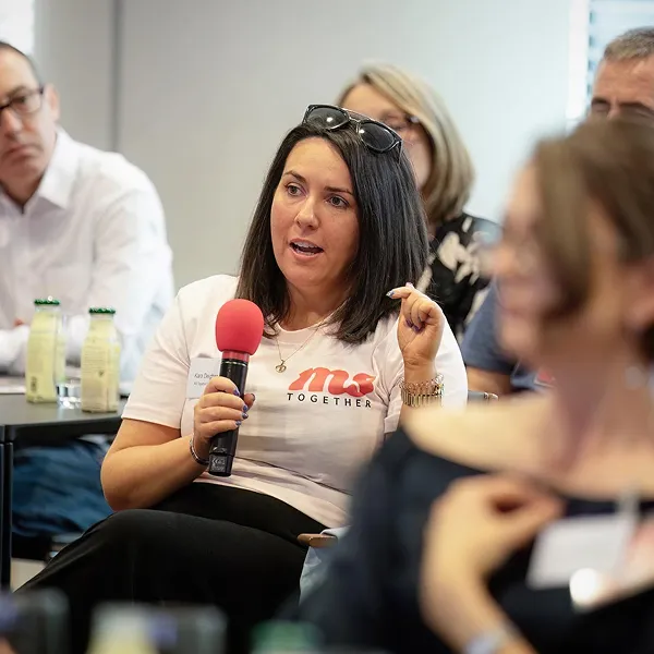 Volunteer speaking at an event