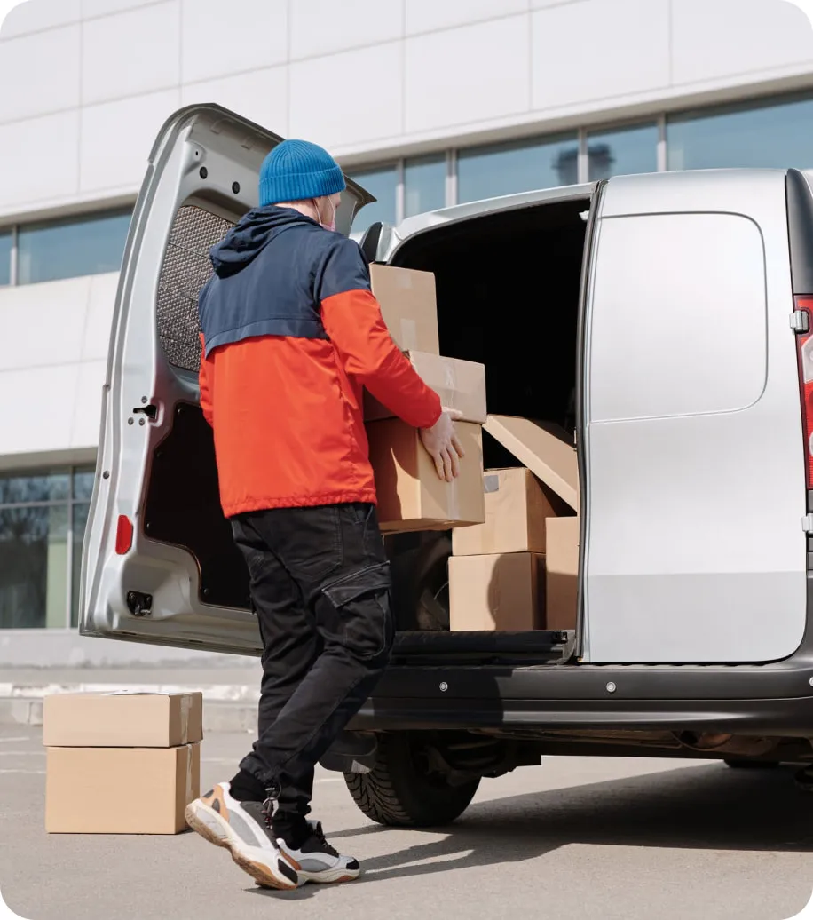 A man loading a van for a delivery service