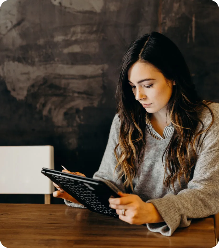 Woman looking at an iPad for financial service advice