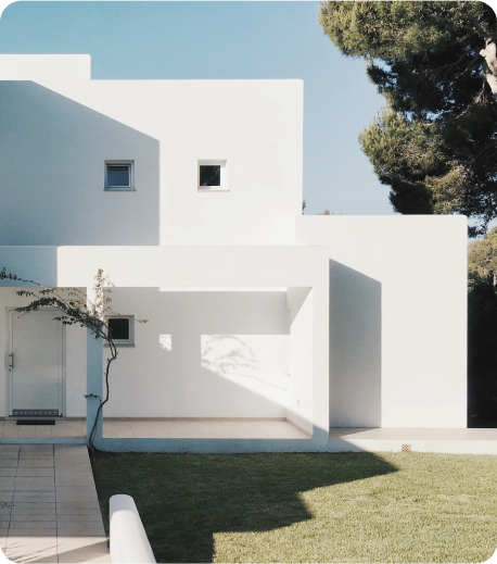 modern-detached-white-house-grass-tree