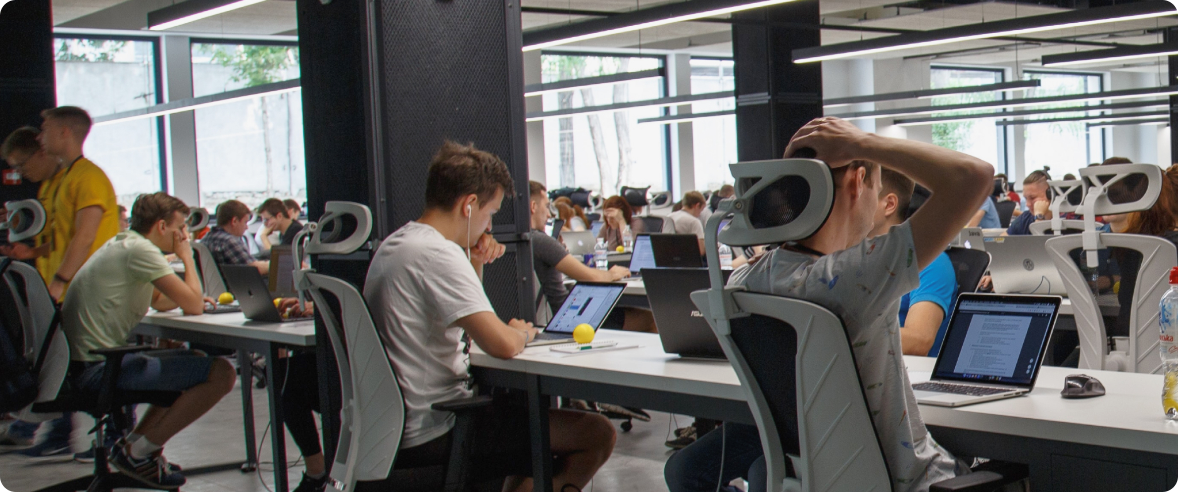 People sitting in a large office while working