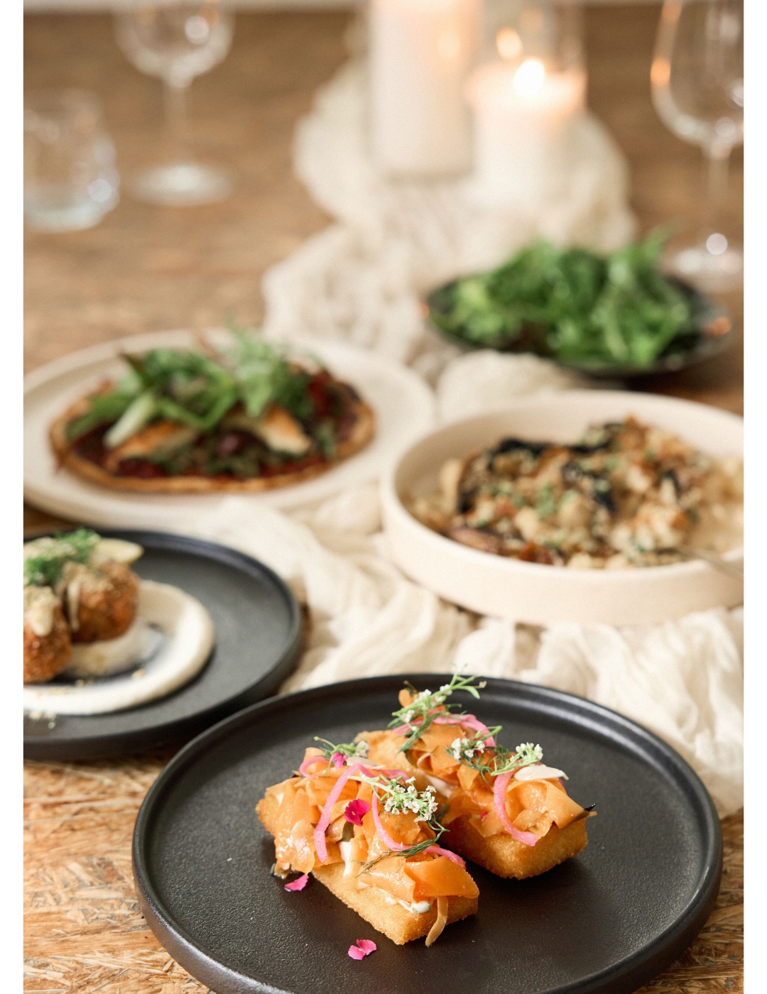 Chef plating seasonal dishes at Greenhouse Canteen