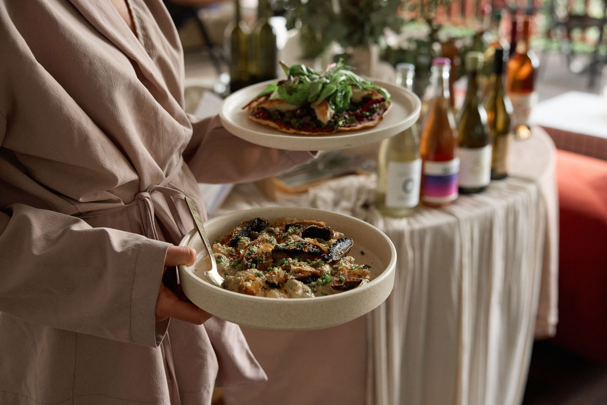 Chef plating seasonal dishes at Greenhouse Canteen