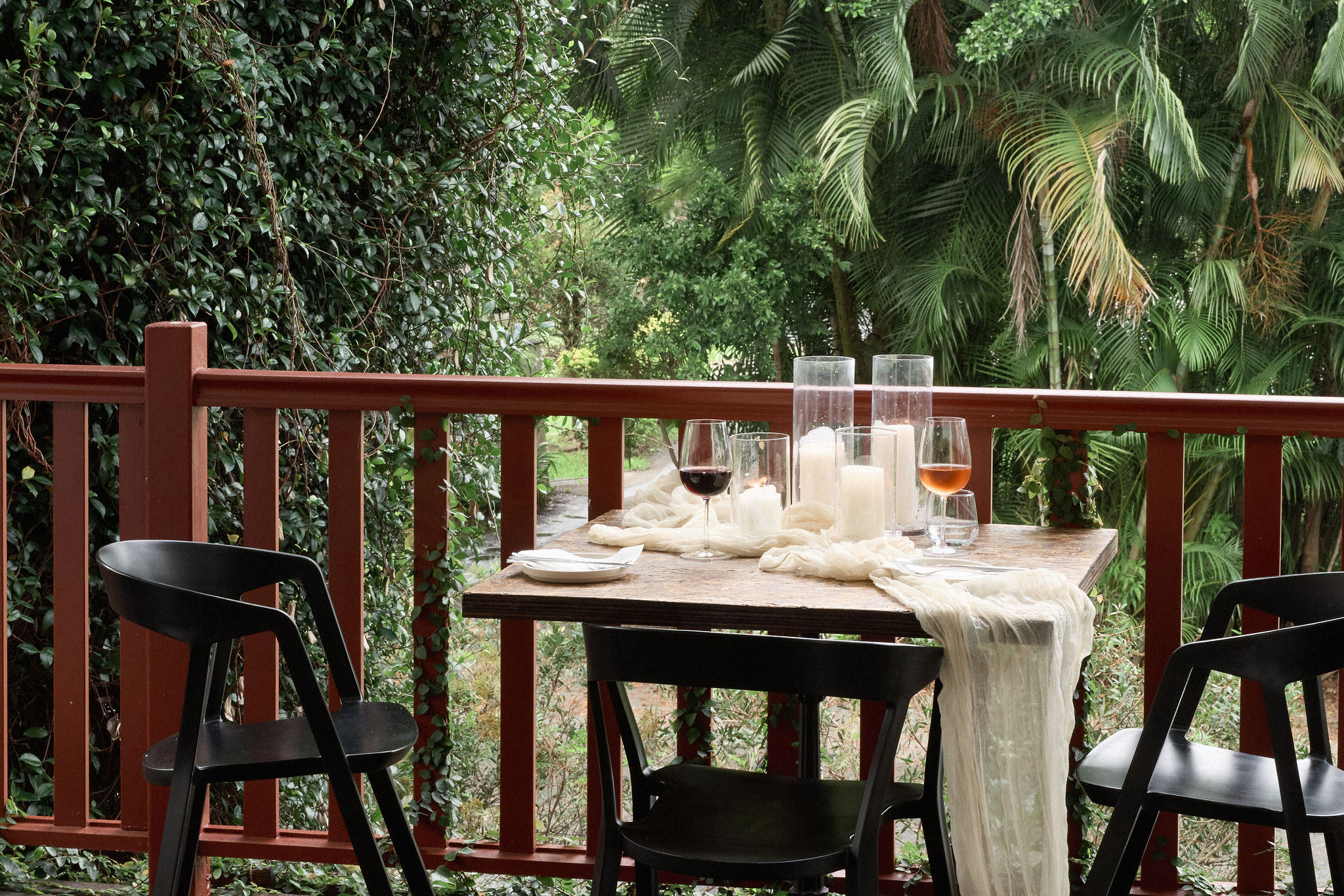 Candlelit dinner table on the deck overlooking the valley at Greenhouse